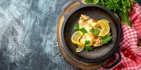 Тиляпия, запеченная с лимоном и чесночным маслом - простой рецепт ужина