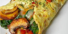 Соковита начинка: рецепт сирного омлета з овочами